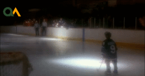 Young Gordon Bombay misses off the post and falls to his knees.